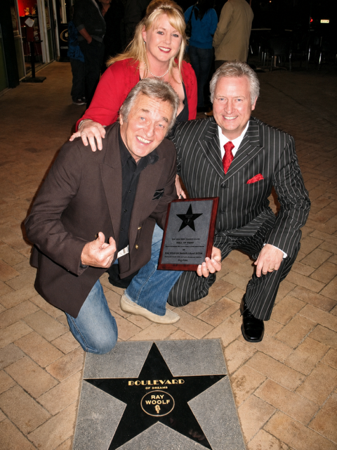Ray Woolf MNZM with Tracey and Gary Brown at the unveiling of the first New Zealand Walk of Fame star on Orewa Boulevard, 1 July 2010