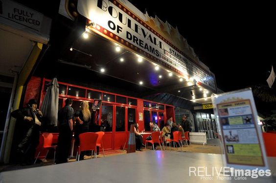 The Boulevard of Dreams restaurant in Orewa at night, its lit marquee reading Stardom — where the New Zealand Walk of Fame began